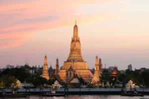 glowing wat arun during sunset